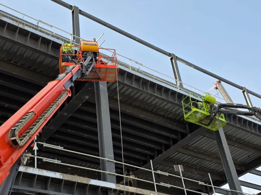 Boom lifts working on the data center structural steel frame