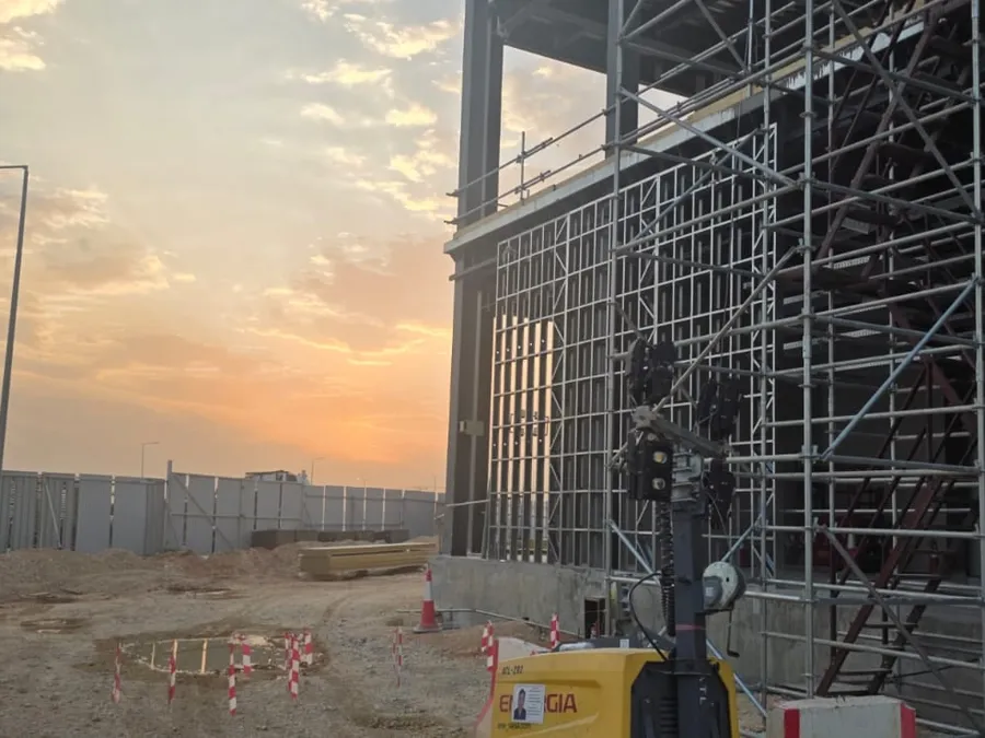 Light-gauge steel framing on the data center façade at sunset