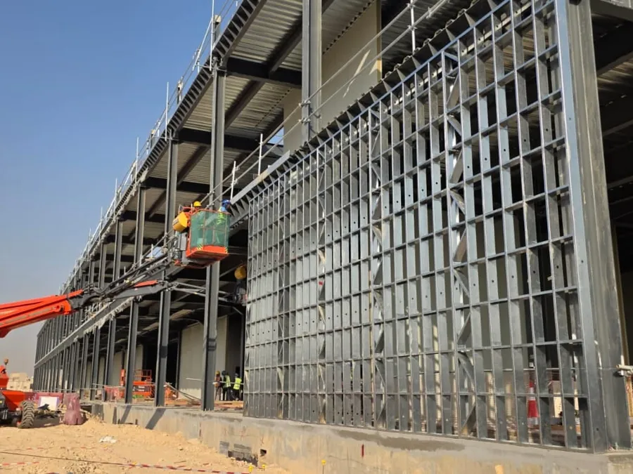 Light-gauge steel wall framing fixed to the structural steel frame of the data center